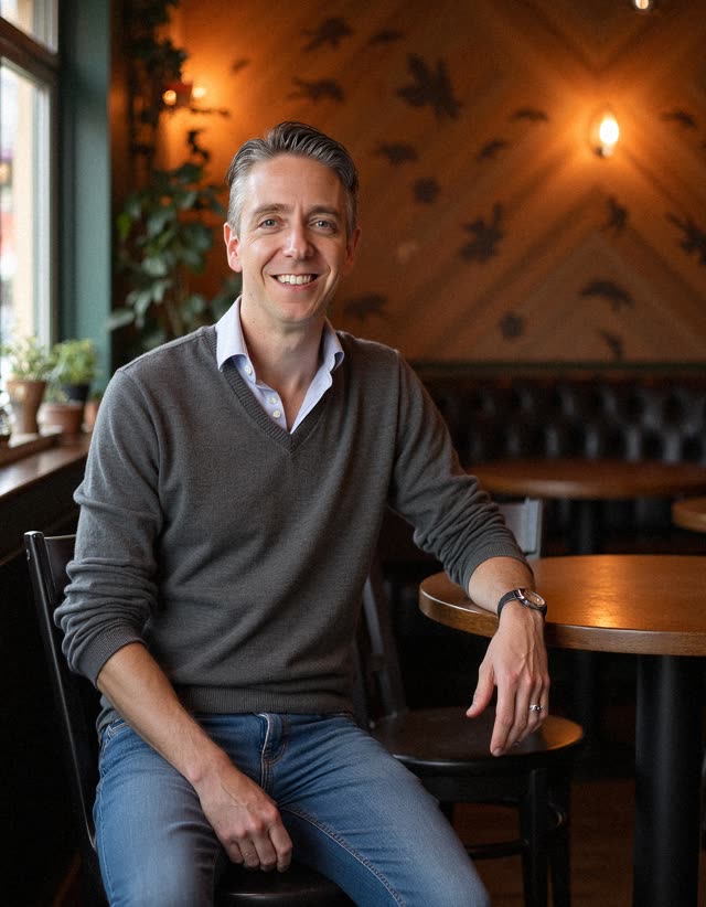 A man sitting in a café, ready for a conversation